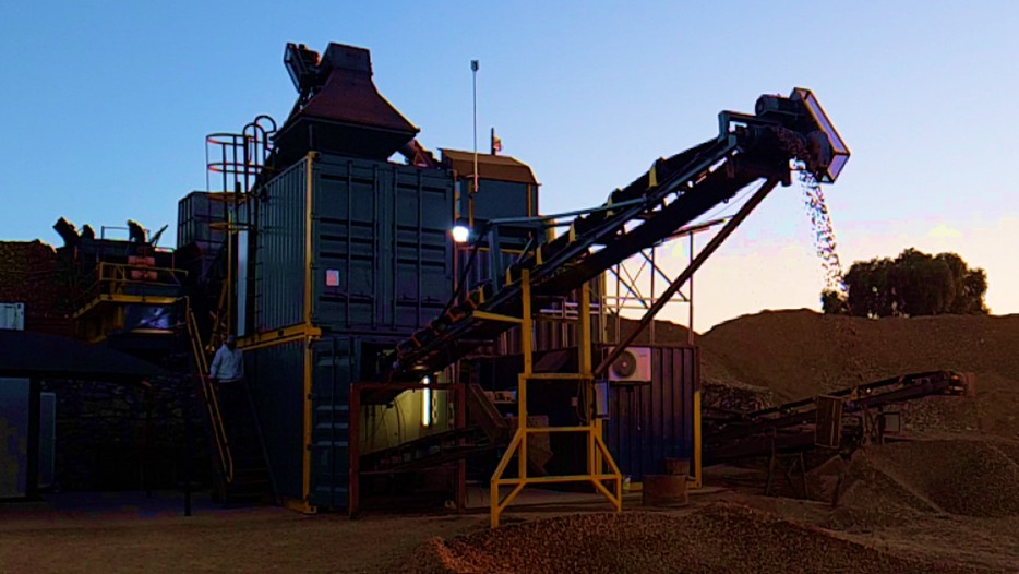 Close view of a conveyor feeding a processing plant