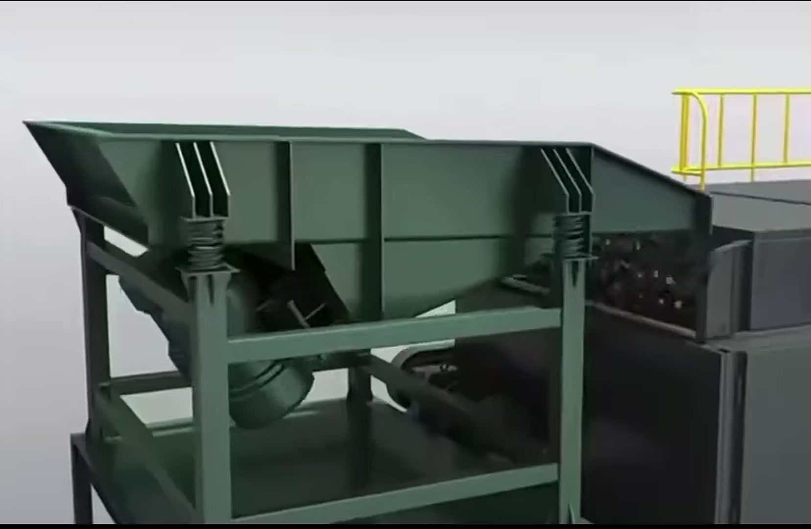 Vibrating feeder discharging ore onto a sorting belt